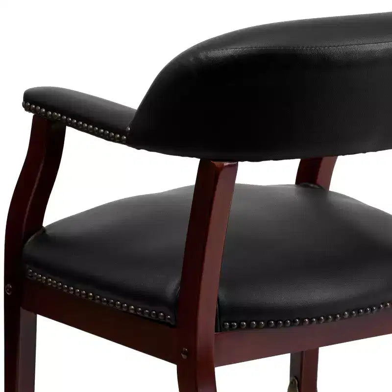 Fauteuil de conférence avec garniture cloutée et roulettes